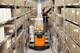 Order picker - Toyota BT Optio 1t Order picker with ladders and wide trolley usage - Application image